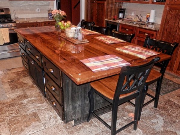 A DIY epoxy kitchen countertop with a dark wooden substrate.