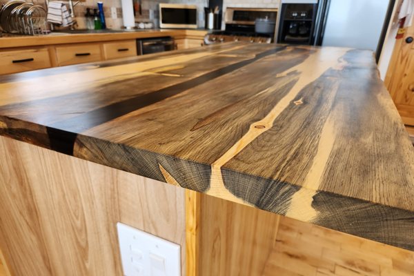 A wooden epoxy river countertop made with UltraClear Bar & Table Top Epoxy.